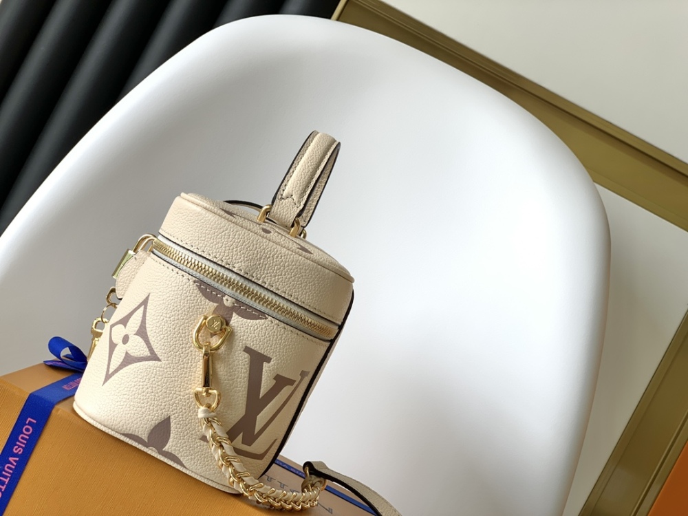 This Vanity Small Handbag Fusion  Giant Monogram embossing, an elegant shape and leather top handles.