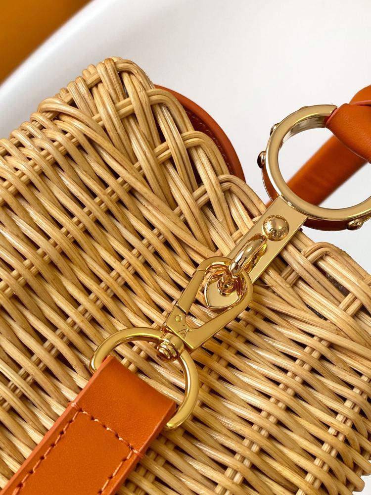 The Capucines BB handbag is a chic composition of woven rattan in homage to the Louis Vuitton picnic case design of 1892.