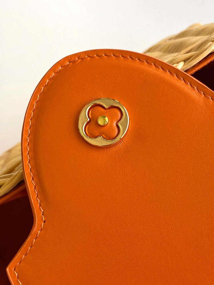 The Capucines BB handbag is a chic composition of woven rattan in homage to the Louis Vuitton picnic case design of 1892.