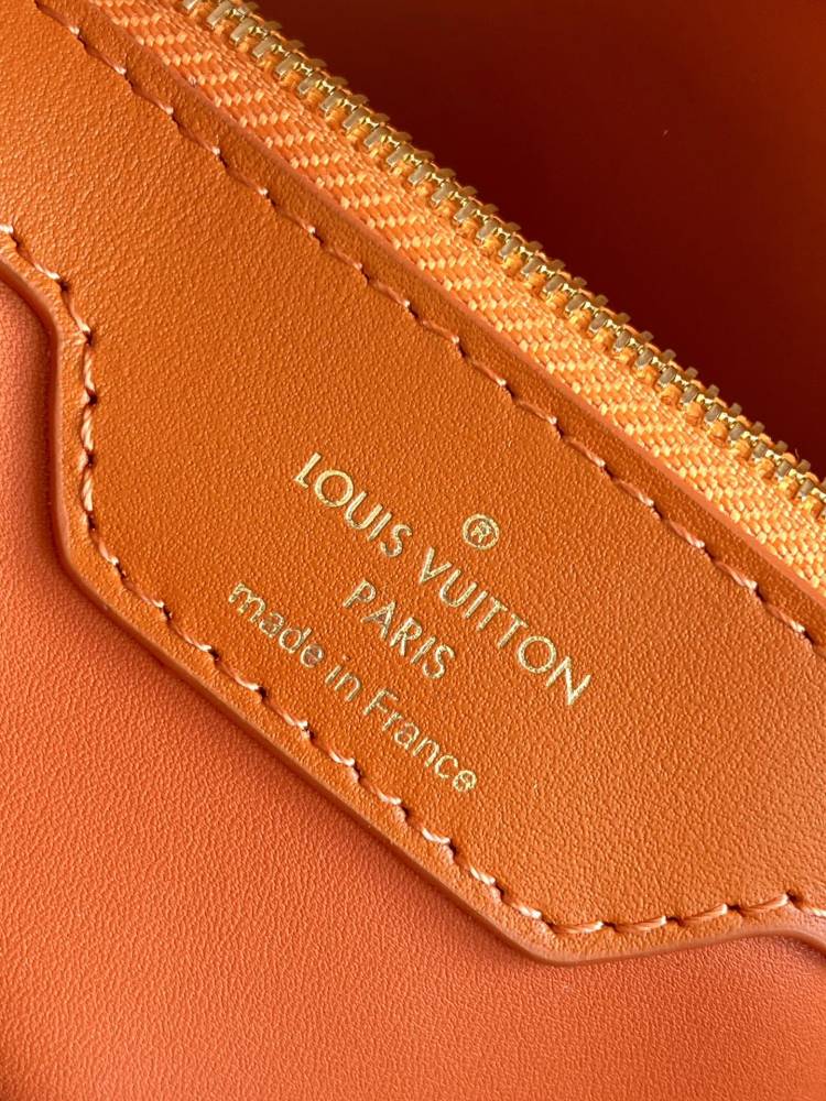 The Capucines BB handbag is a chic composition of woven rattan in homage to the Louis Vuitton picnic case design of 1892.