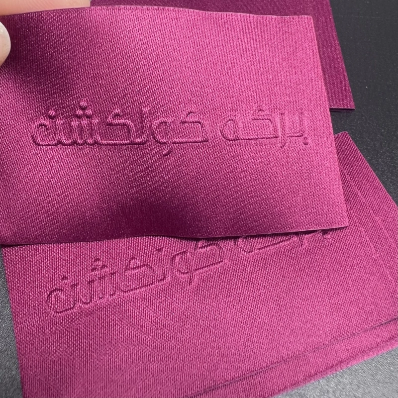 Custom High Density Woven Label Raised Embossed High Frequency Polyester Garment Labels for Clothes Pants Skirts