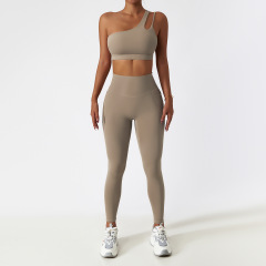 One-shoulder trousers in a brownish-skin color