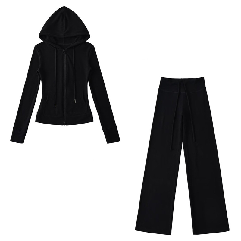 Relaxed fit red tracksuit with long-sleeved hooded zip-up jacket and loose drawstring wide-leg pants.