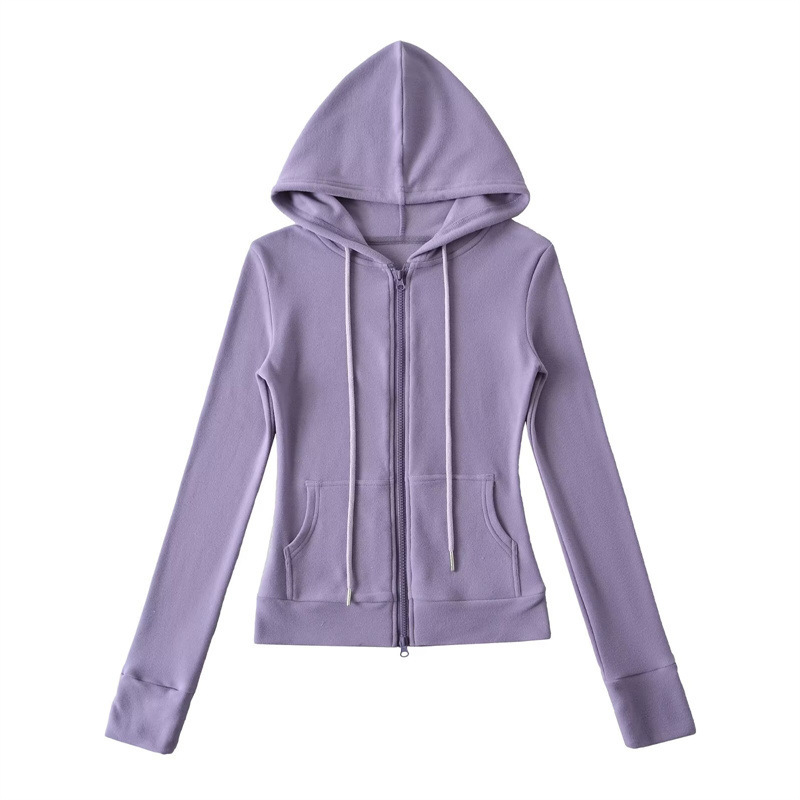 Relaxed fit red tracksuit with long-sleeved hooded zip-up jacket and loose drawstring wide-leg pants.