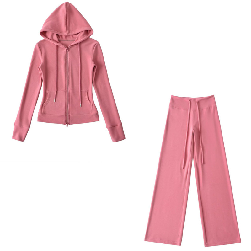 Relaxed fit red tracksuit with long-sleeved hooded zip-up jacket and loose drawstring wide-leg pants.