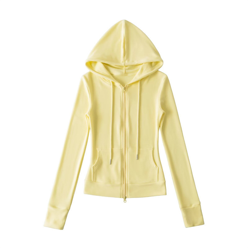 Relaxed fit red tracksuit with long-sleeved hooded zip-up jacket and loose drawstring wide-leg pants.
