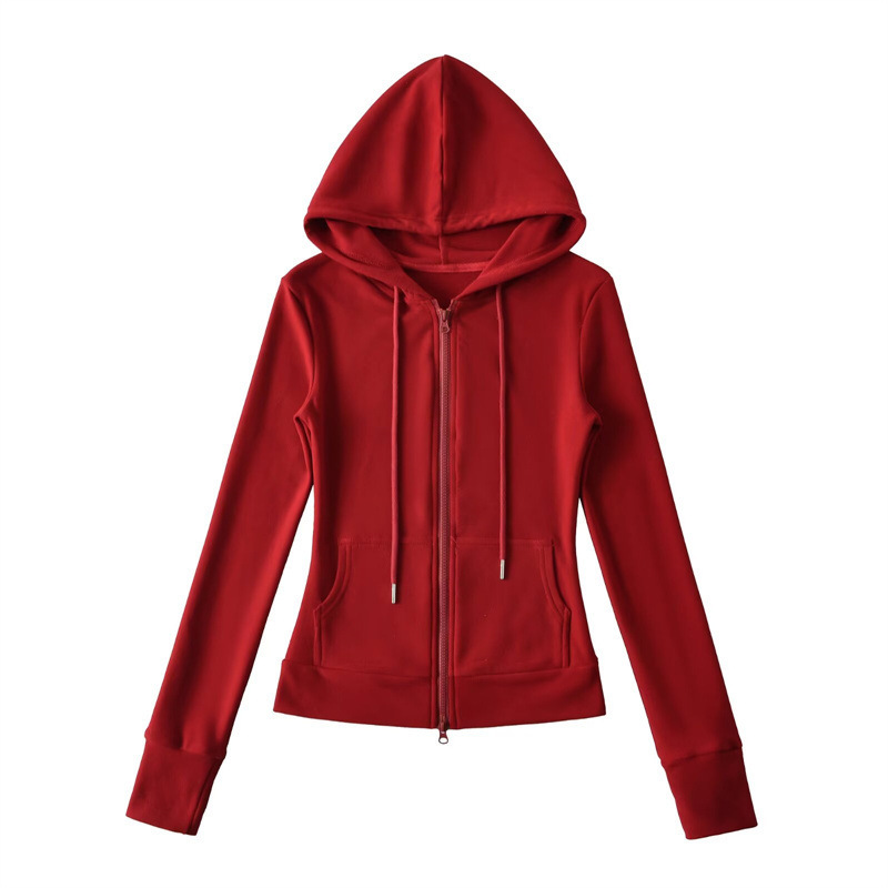Relaxed fit red tracksuit with long-sleeved hooded zip-up jacket and loose drawstring wide-leg pants.