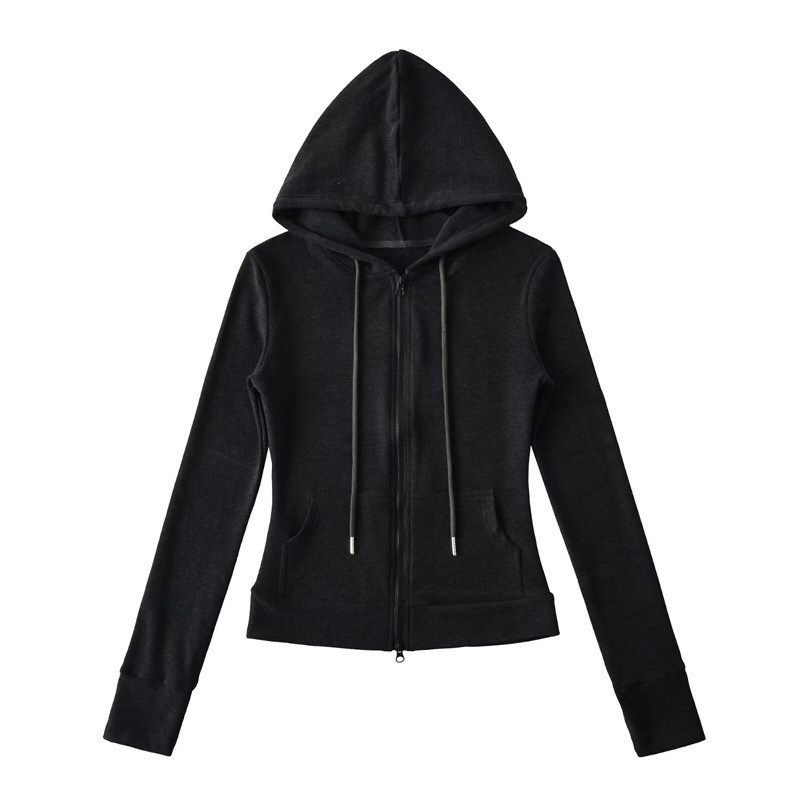 Relaxed fit red tracksuit with long-sleeved hooded zip-up jacket and loose drawstring wide-leg pants.