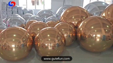 christmas holiday corporate event decor styling luxury giant Shimmering Gold big shiny balls Silver Balloon Orbs