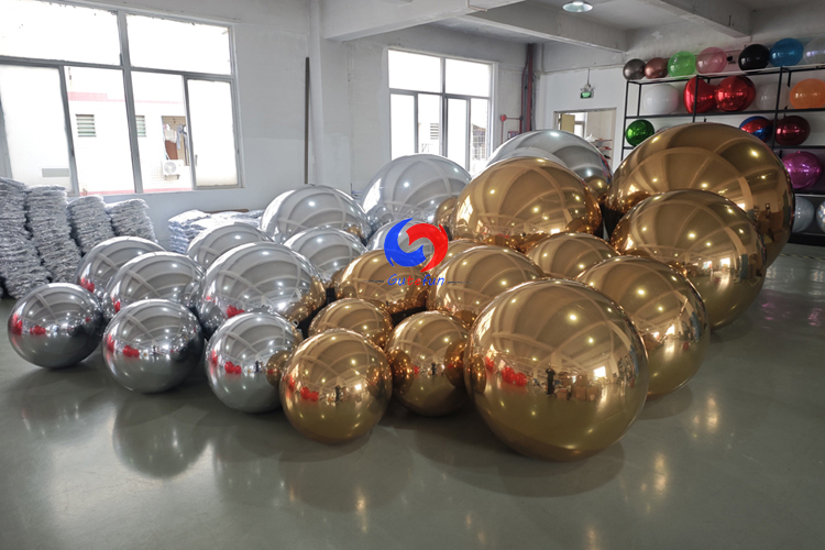 christmas holiday corporate event decor styling luxury giant Shimmering Gold big shiny balls Silver Balloon Orbs