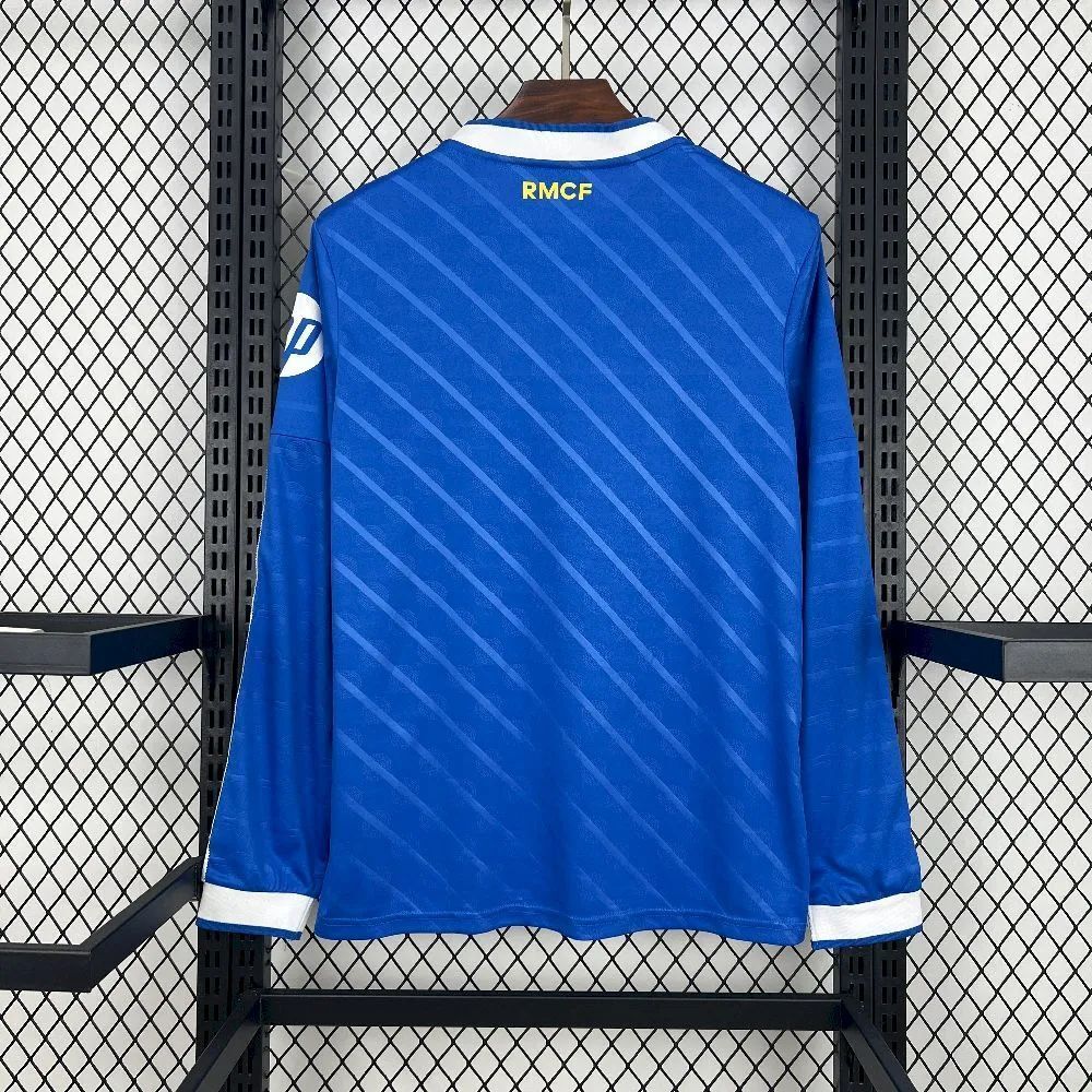 Back view of 2025-26 Real Madrid second away jersey fan version long-sleeve in blue, featuring white cuffs and yellow RMCF lettering for a clean modern look.