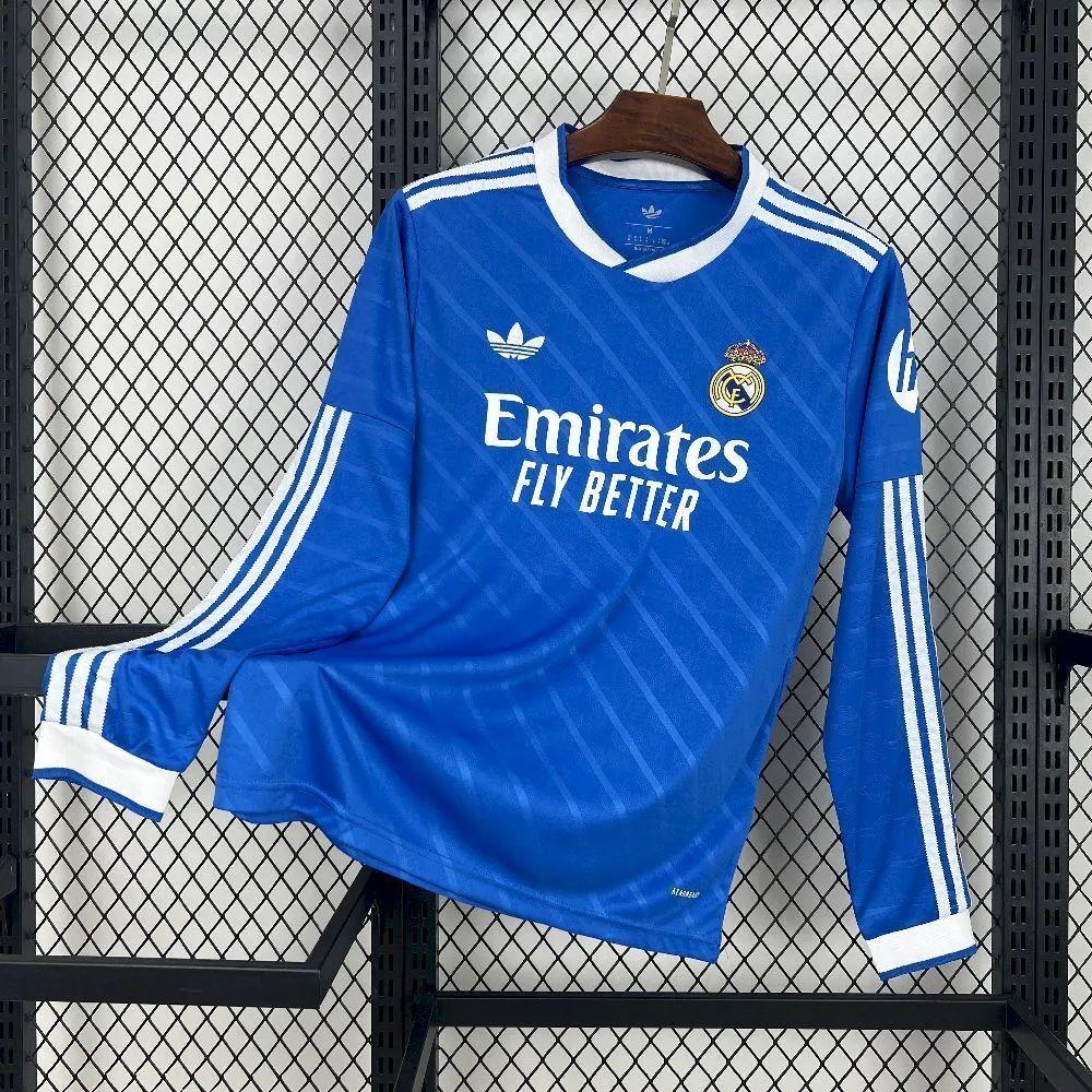 2025-26 Real Madrid second away jersey fan version long-sleeve in blue with white cuffs and shoulder stripes, featuring Adidas logo and Emirates Fly Better sponsor.