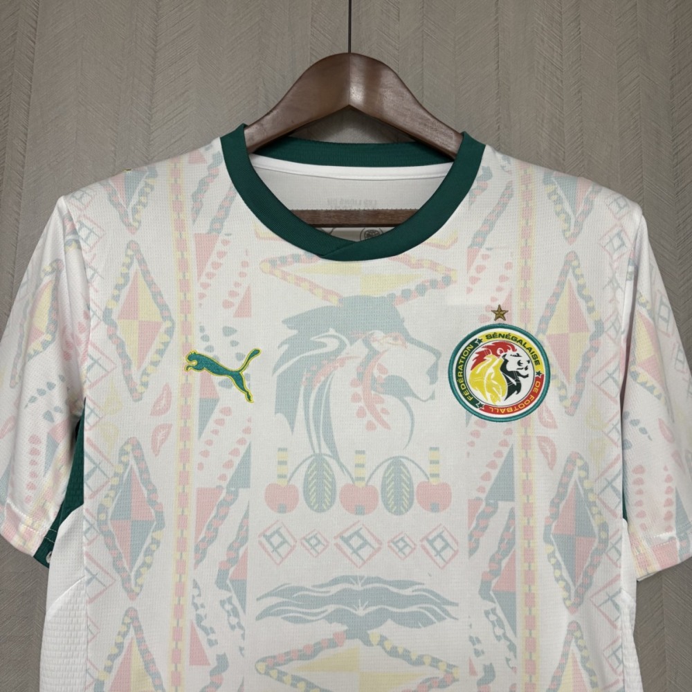 Front view of Senegal 2026 World Cup home jersey with white base, green collar, and traditional African-inspired pattern