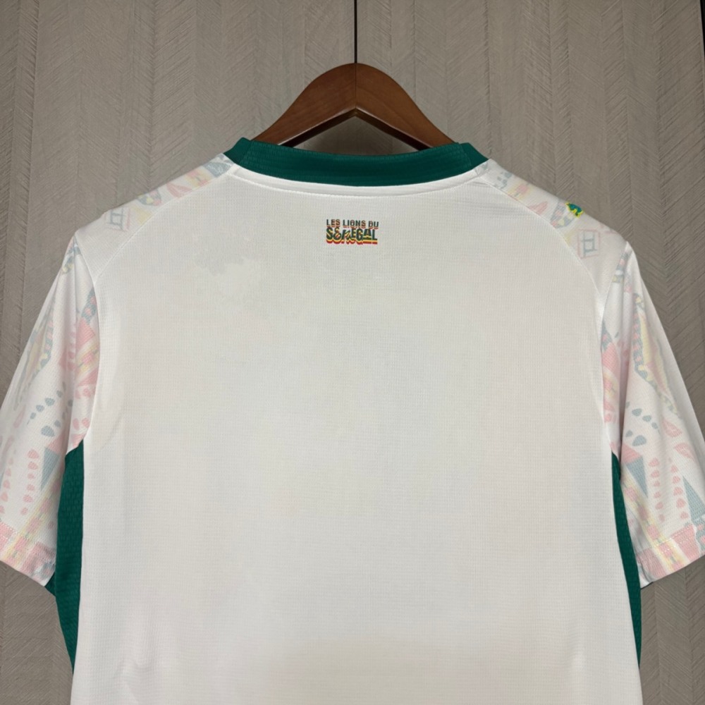 Close-up of back collar detail with “Les Lions du Sénégal” text on Senegal home jersey