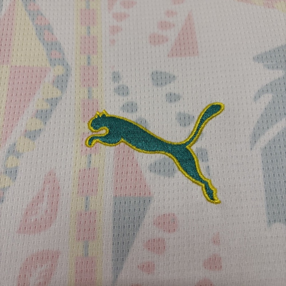 Close-up of embroidered Puma logo on Senegal 2026 home football jersey