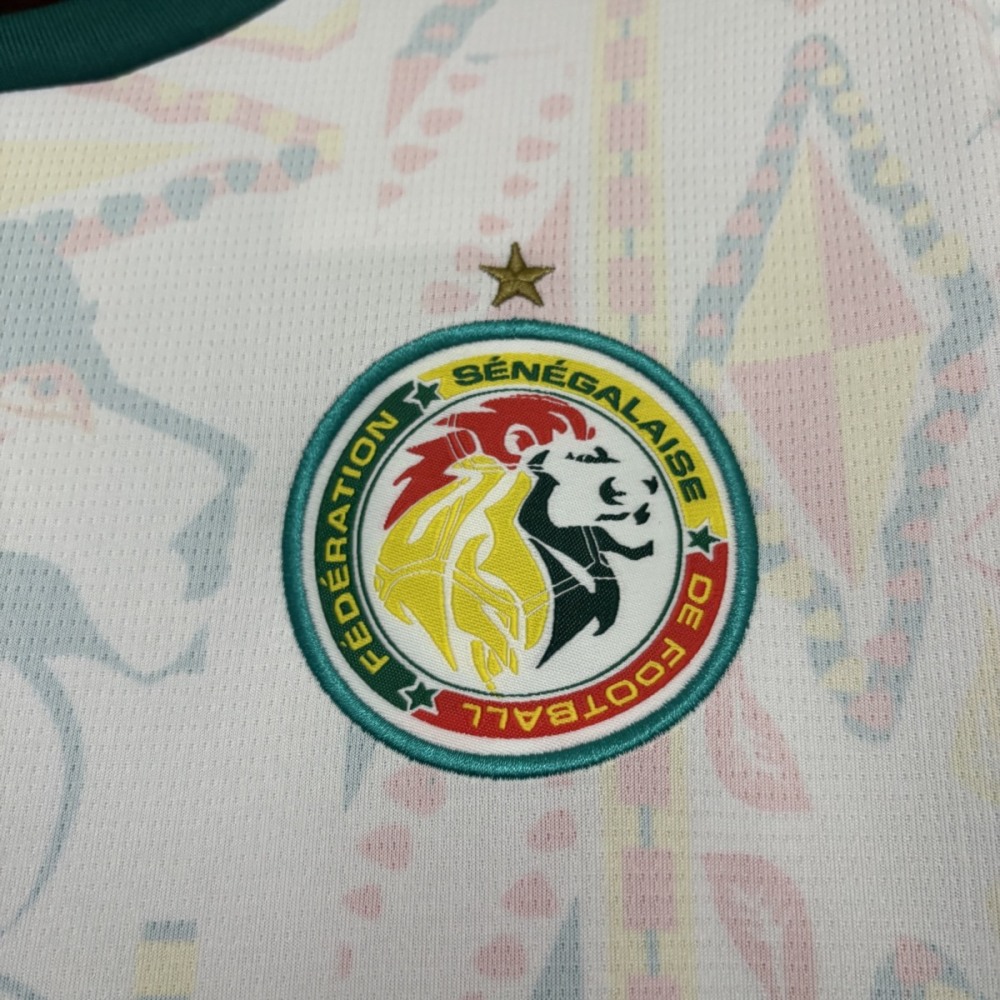 Close-up of Senegal national team crest with star above on 2026 World Cup home jersey