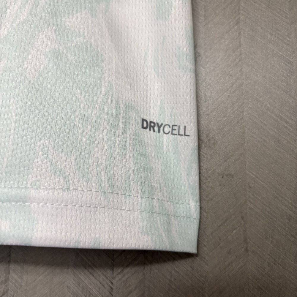 Close-up of the lower hem of the Portugal 2026 World Cup away jersey showing the Puma DryCELL performance technology print.