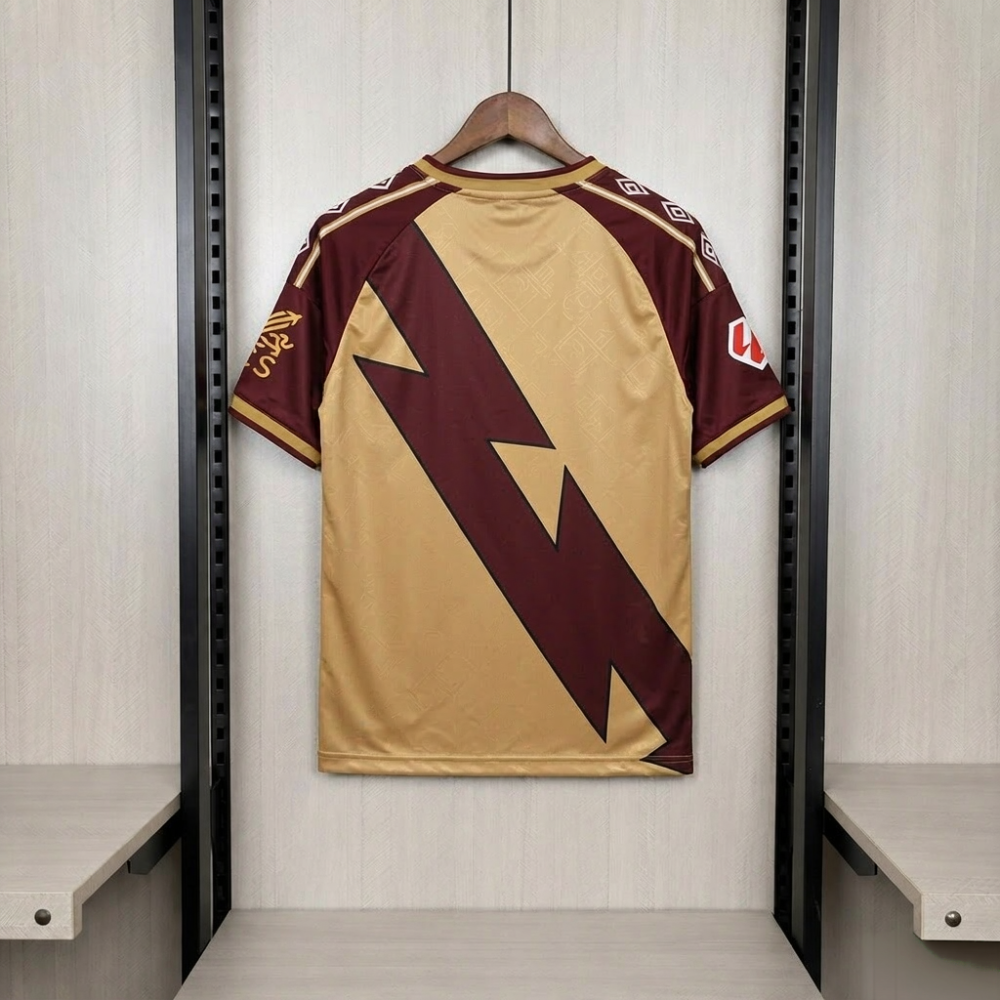 Rayo Vallecano 2026-27 third shirt back - oversized maroon lightning sash on gold, Umbro diamond sleeve prints
