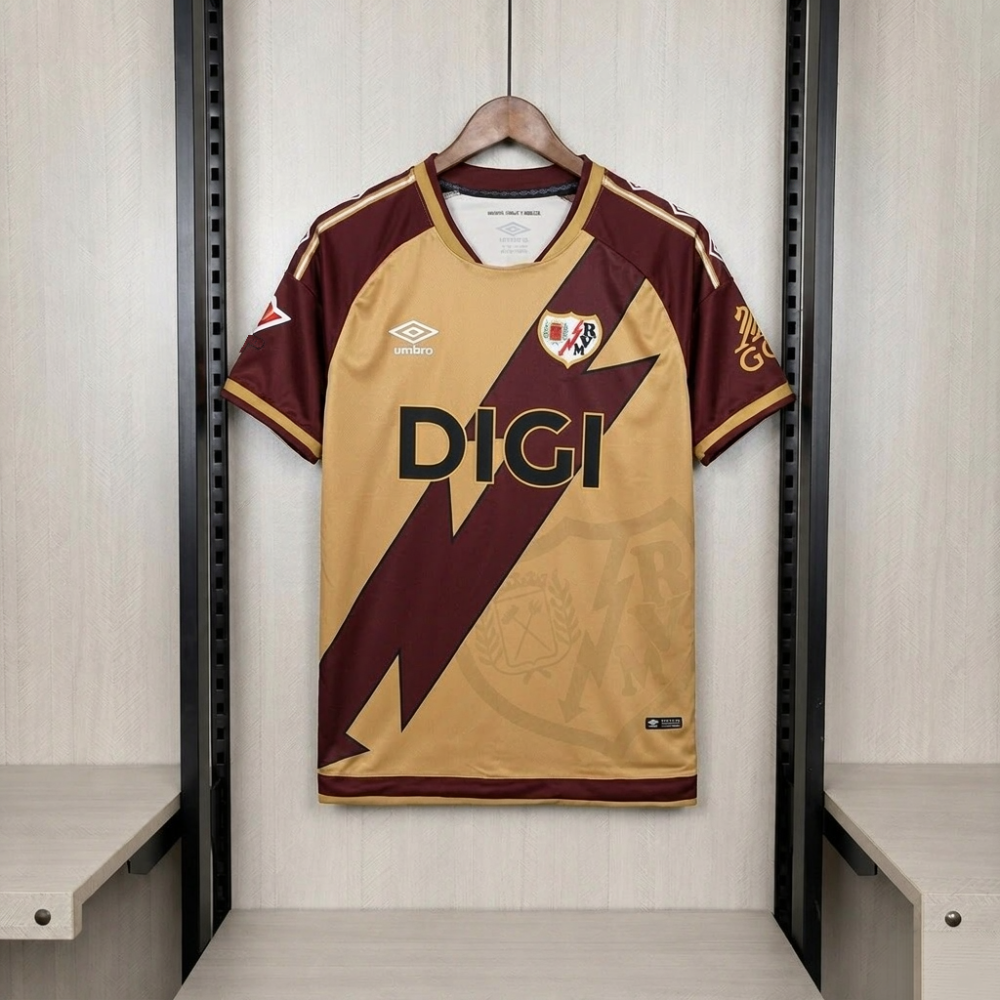 Rayo Vallecano 2026/27 third jersey front - gold Umbro kit with maroon lightning bolt and DIGI sponsor