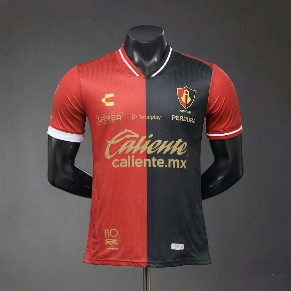 Front view of 2026-27 Atlas FC home jersey player version, red and black half-split 110th anniversary edition with gold sponsor prints