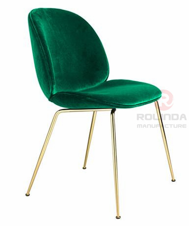 Danish design replicates the golden leg furniture of the Guppy Beetle dining chair