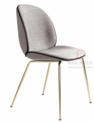 Danish design replicates the golden leg furniture of the Guppy Beetle dining chair