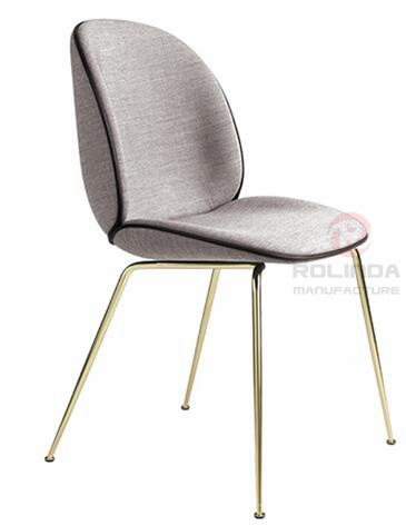 Danish design replicates the golden leg furniture of the Guppy Beetle dining chair