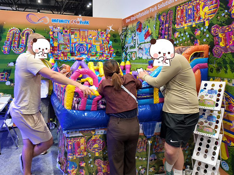 Inflatable slide models demonstration at exhibition booth