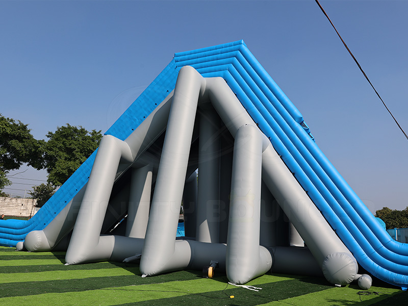 Side view of extra-long inflatable water slide showing support structure