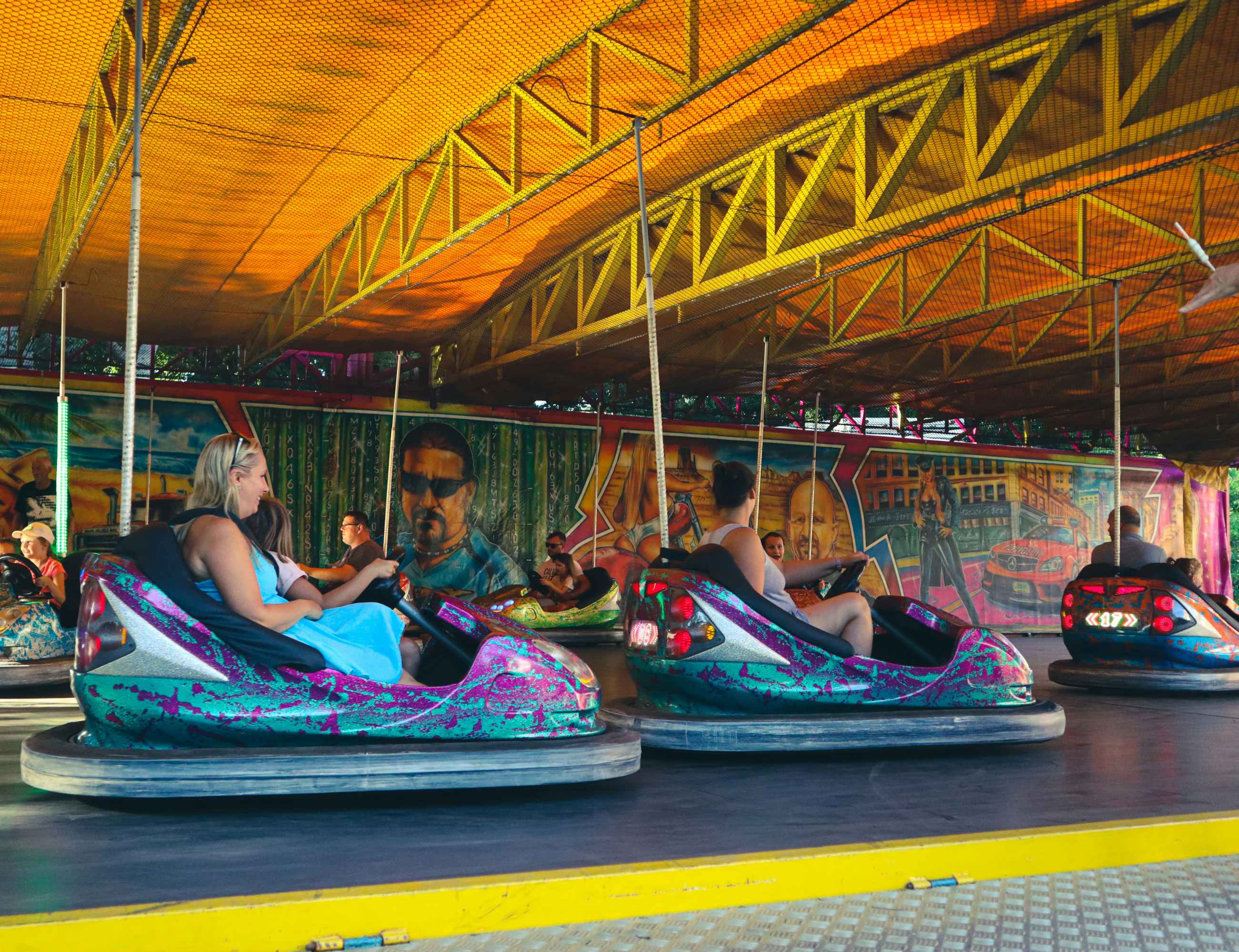 bumper cars for sale - operator inspecting bumper car safety before ride starts