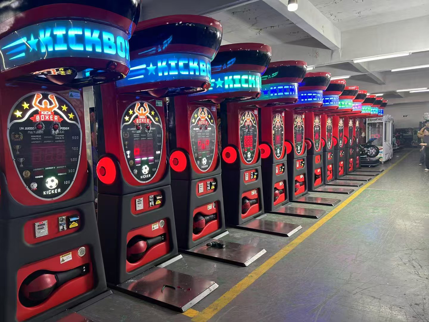 Commercial boxer arcade machines lined up in manufacturer factory