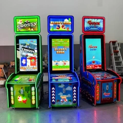 Front view of the QUICK DROP arcade cabinet with illuminated header and single button control
