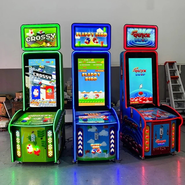 Front view of the QUICK DROP arcade cabinet with illuminated header and single button control
