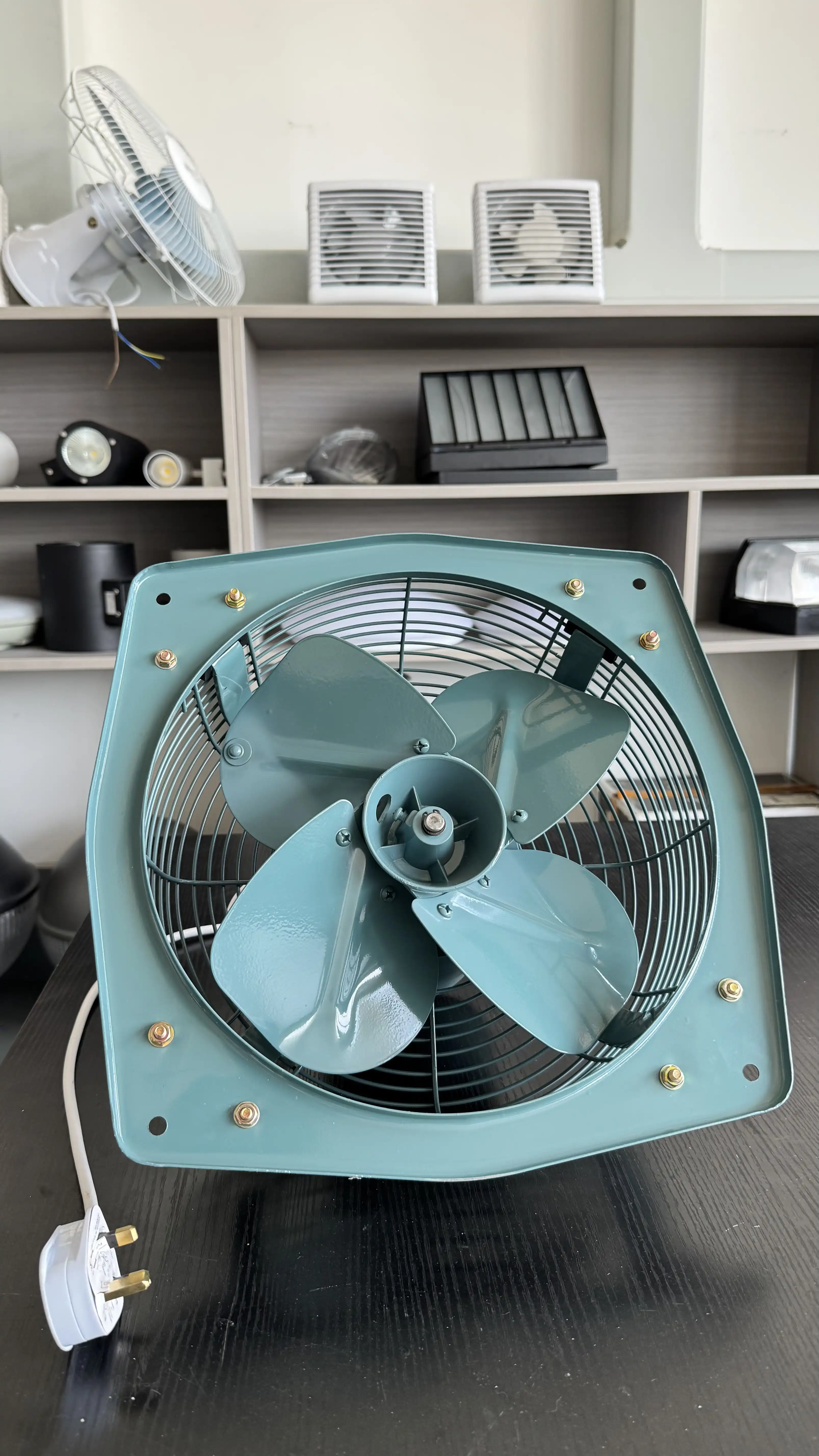 Rear view of industrial wall mount exhaust fan emphasizing the thermal protector housing