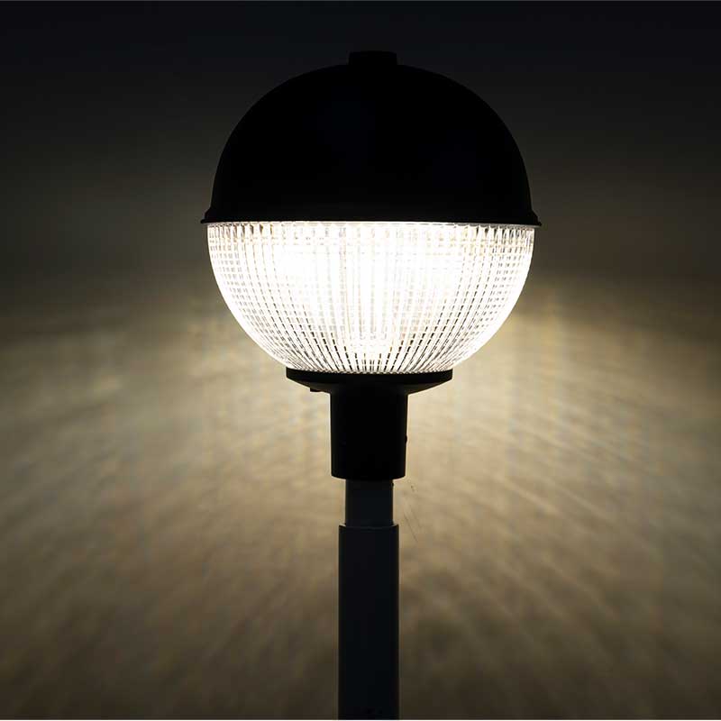 Close up detail of modern outdoor LED landscape lighting fixture showing material texture