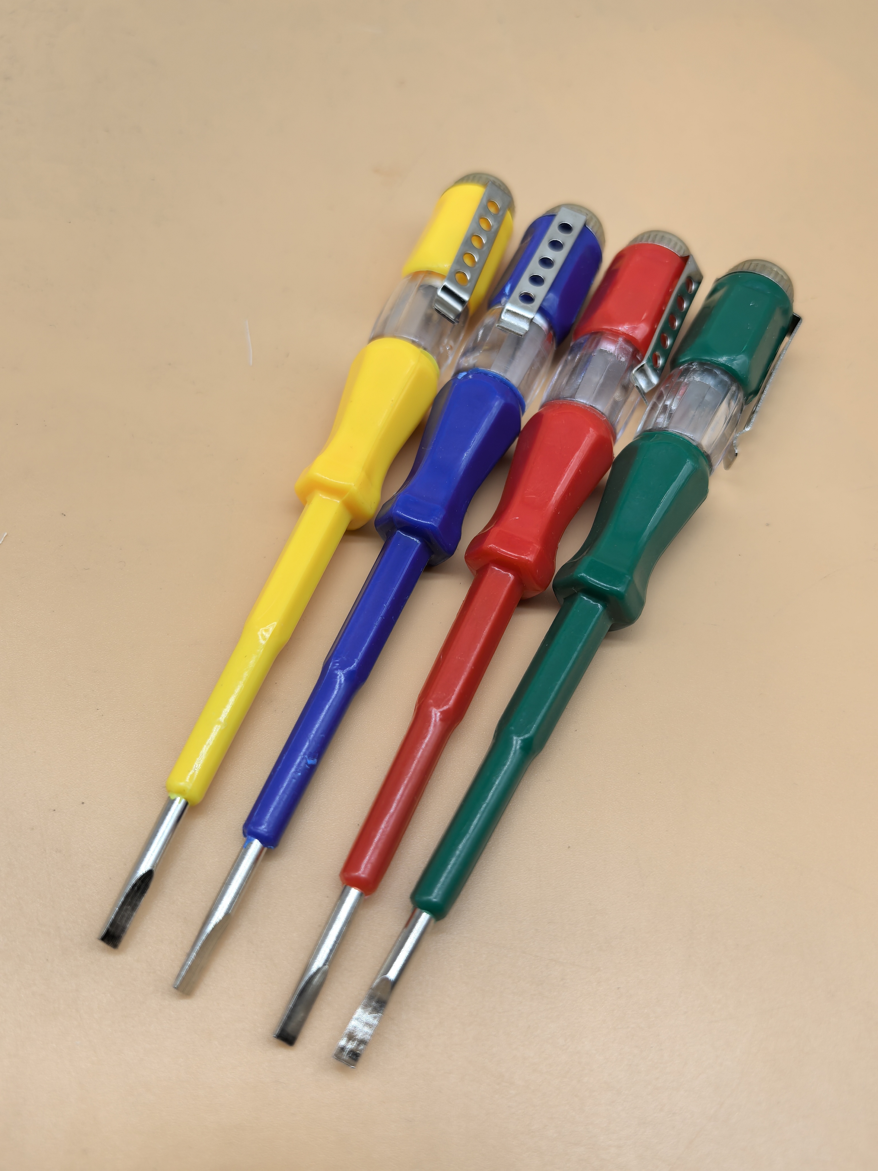 Ergonomic Grip‌ - The brightly colored handle provides a comfortable and slip-resistant grip for precise electrical testing