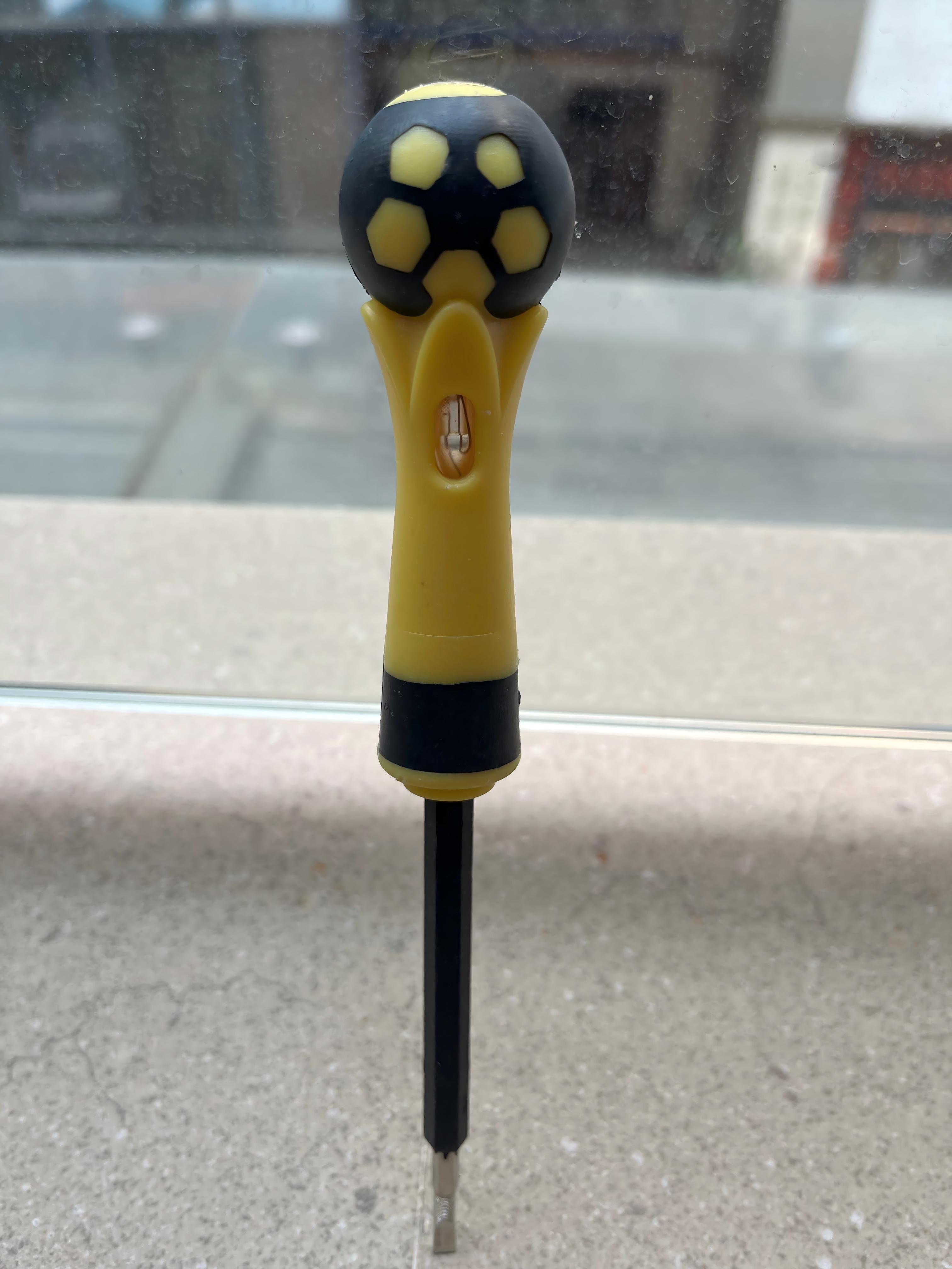A ball-handled safety electrical test pen with a neon lamp and screwdriver function.