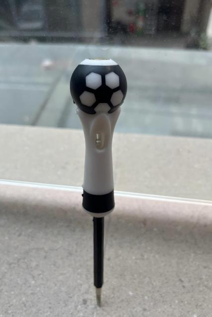 A ball-handled safety electrical test pen with a neon lamp and screwdriver function.