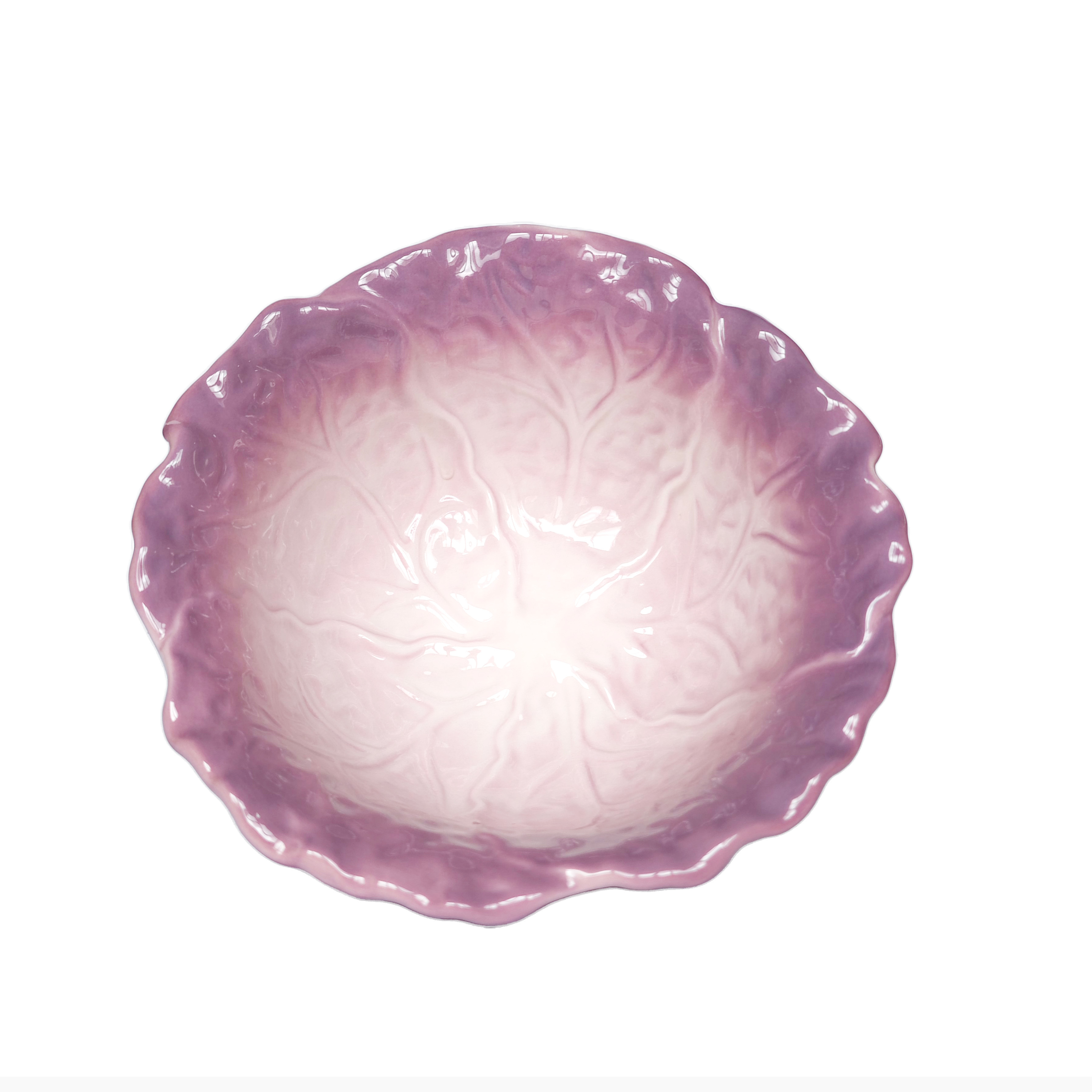 cabbage-shaped ceramic bowl on wooden table