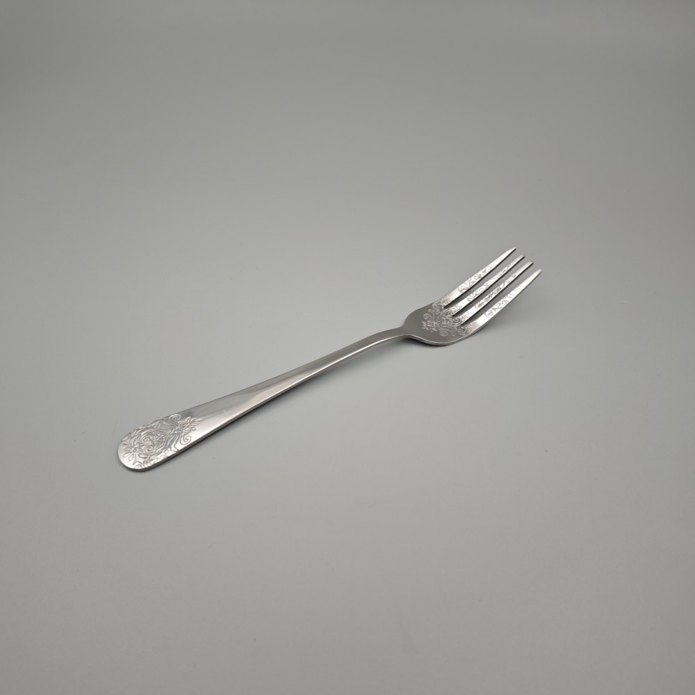 Silver - Toned Cutlery Set with Ornate Patterns - Elegant Tableware
