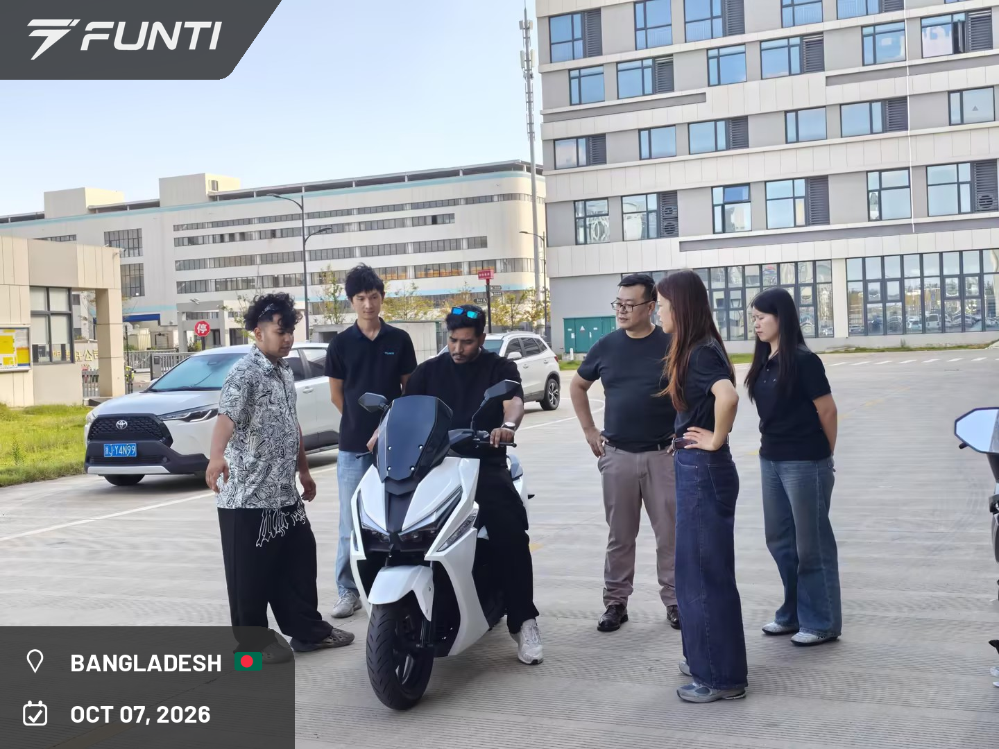 The visiting customer test riding the V22 maxi scooter on the FUNTI factory test route, Taizhou, China, October 7, 2026