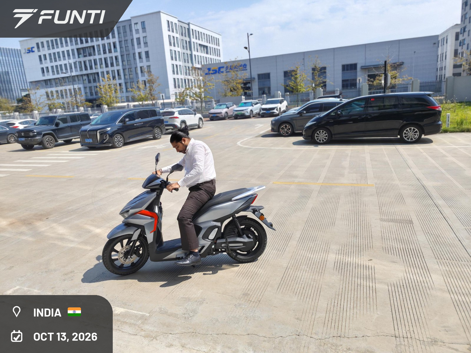 The visiting customer test riding the FUNTI 008 electric scooter, Taizhou, China, October 13, 2026