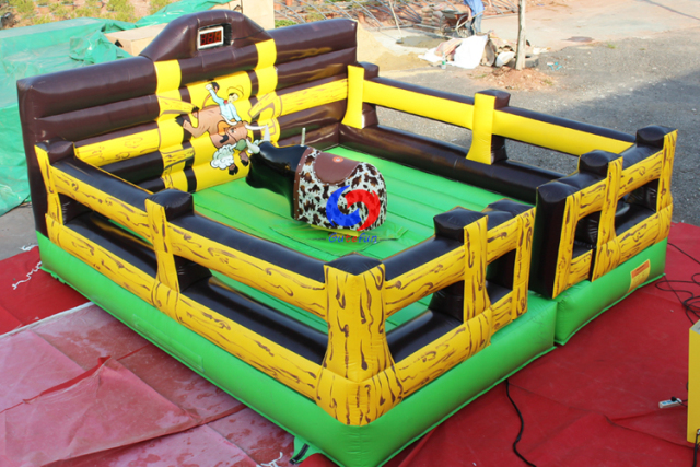 attention-grabbing western corral themed inflatable cushion mechanical rodeo bull riding simulator machine for sale