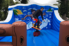 surfing-themed mechanical rodeo riding surf surfboard, Surf Simulator Ride with inflatable crash mat