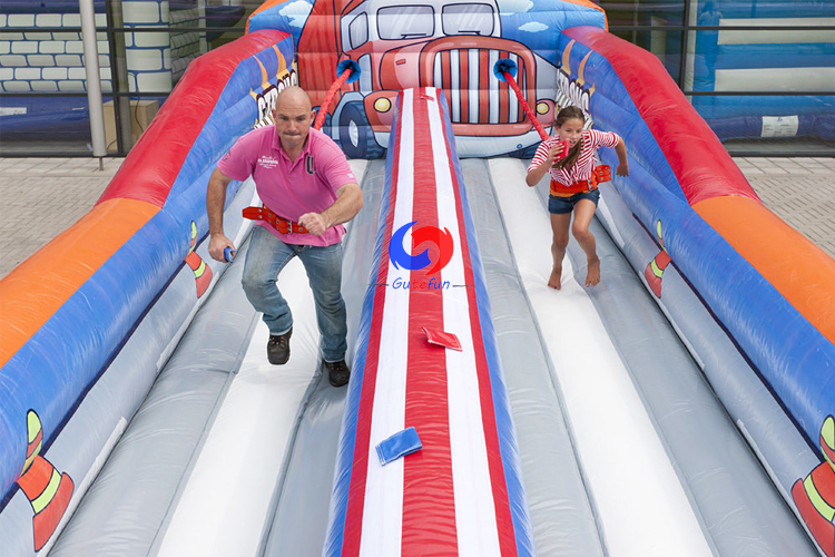 strongest man double lanes bungee games inflatable bungee run 2 lanes for sale