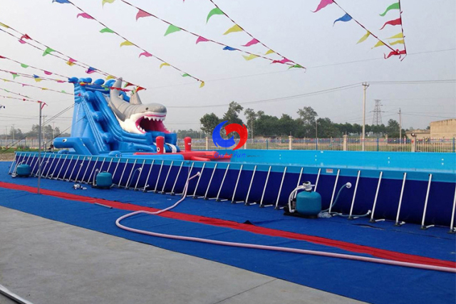 commercial movable large above ground metal frame swimming pools with big shark inflatable water slides for sale