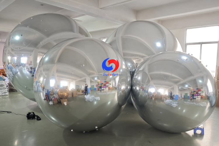 Corporate celebration backdrop giant balloons big shiny silver inflatable sphere mirror balls as decoration