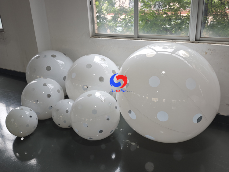 Clean white polka dot giant inflatable pickleballs in assorted mixed sizes, designed for all USA Pickleball events!