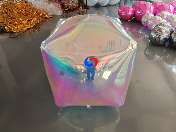 Matte frosted inflatable rounded cube with full‑surface subtle pearlescent iridescent tint
