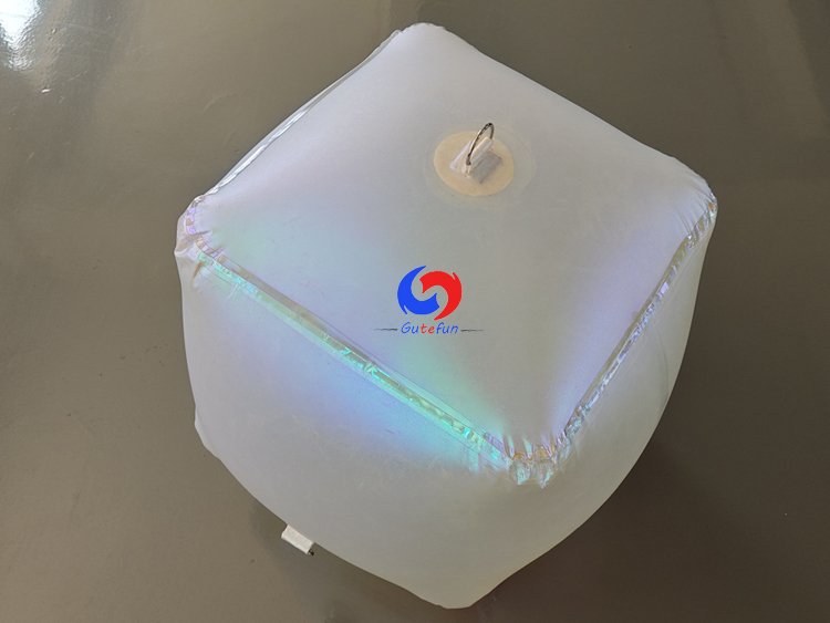 Matte frosted inflatable rounded cube with full‑surface subtle pearlescent iridescent tint